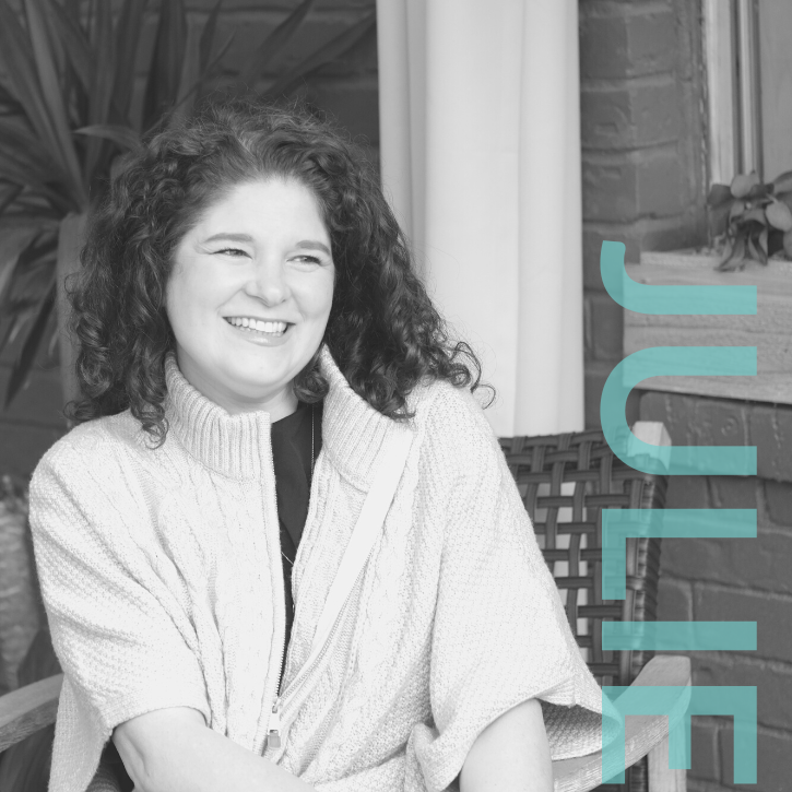 Image of Julie Afsahi lead trainer sitting in a chair.